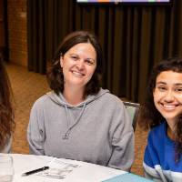 three people at luncheon table